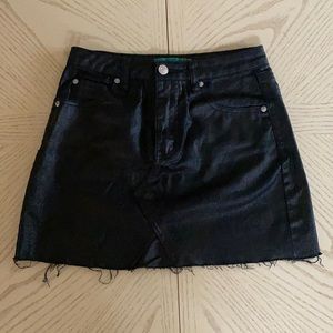 Black denim mini skirt.